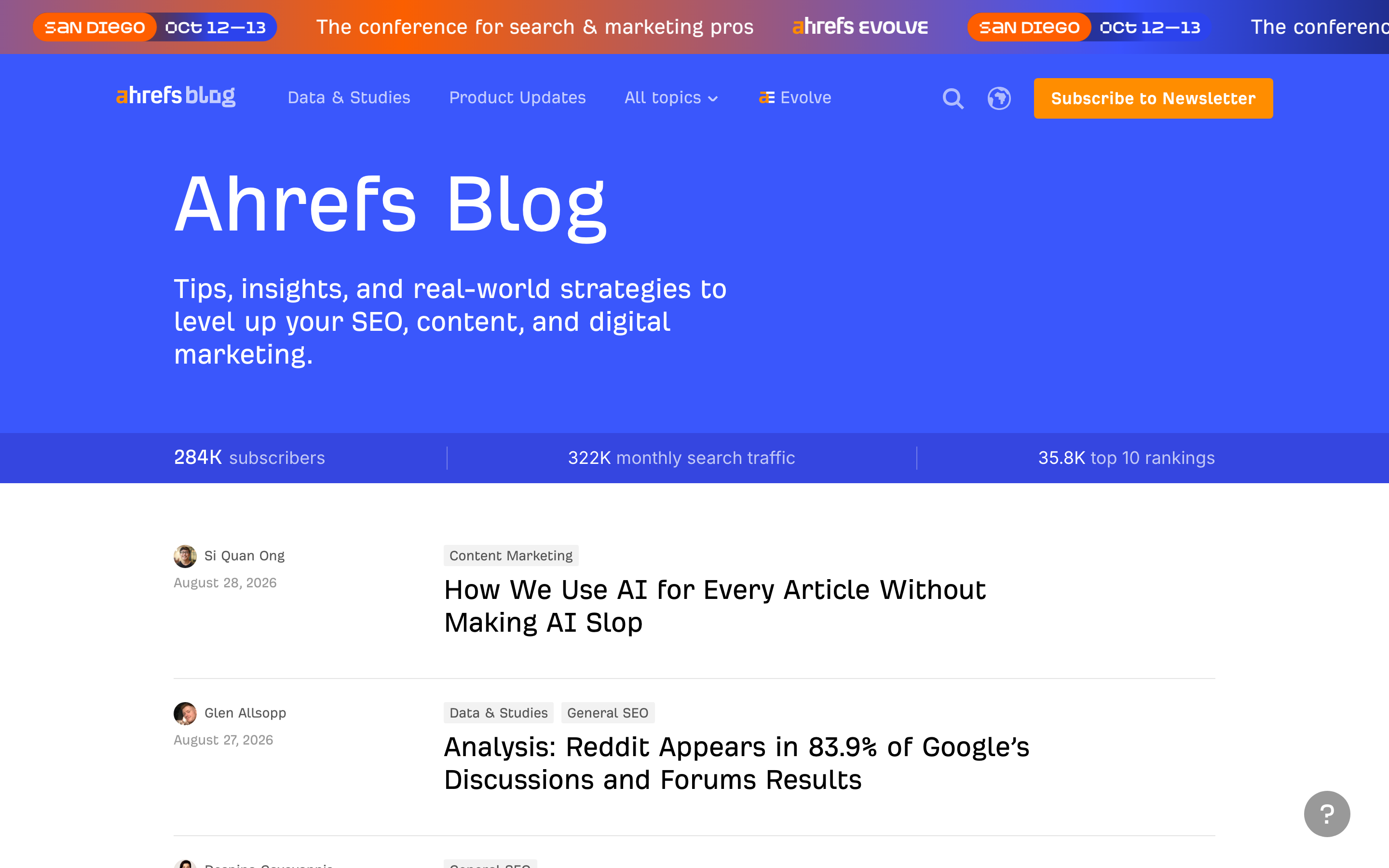 The Ahrefs blog index, where each article row shows one or two category chips above the headline.
